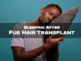 A man sleeping after FUE hair transplant in an upright position with a neck pillow to protect hair transplant grafts.