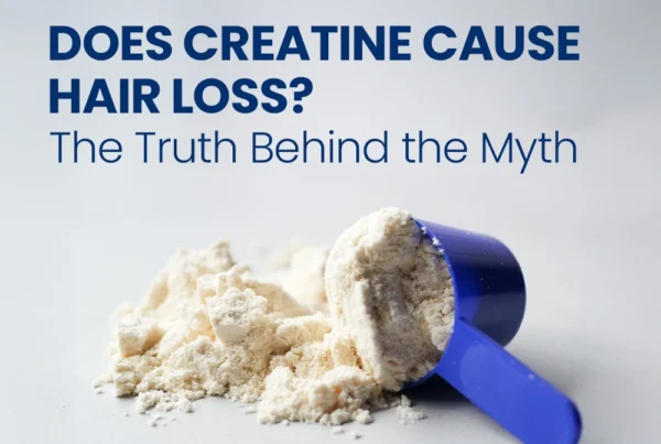 Scoop of white powder supplement with text "Does Creatine Cause Hair Loss? The Truth Behind the Myth."