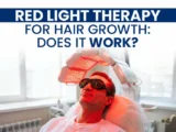 Man wearing protective goggles under a red light therapy device with text asking if red light therapy for hair growth works.